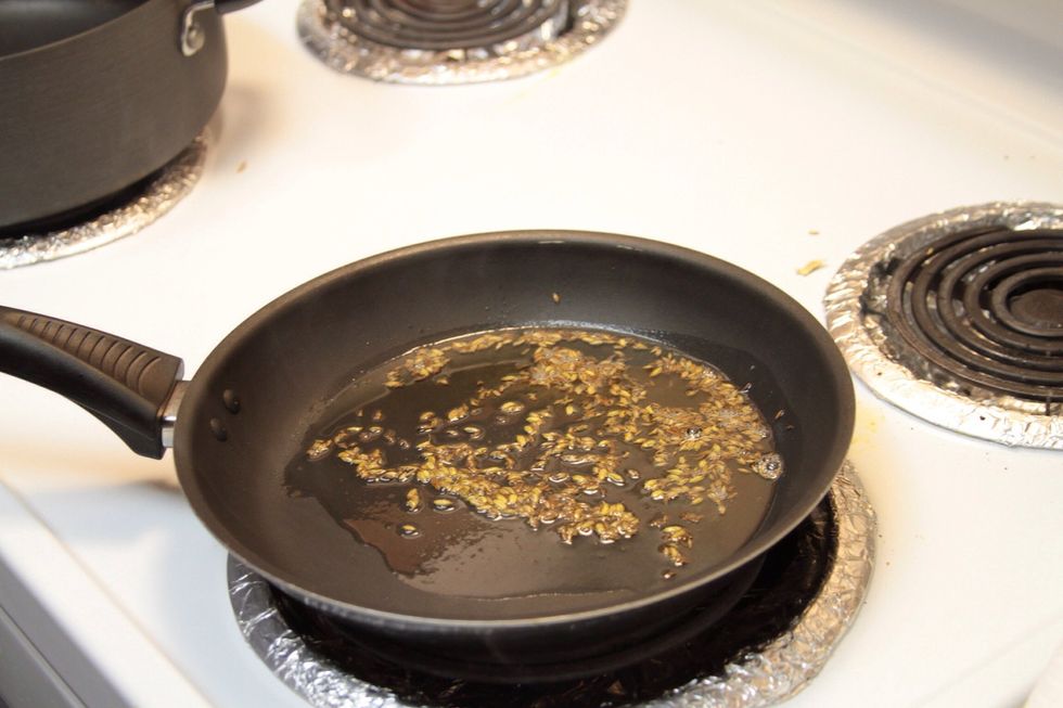 Once the fennel seeds crack add the cumin seeds and fry till they become light brown