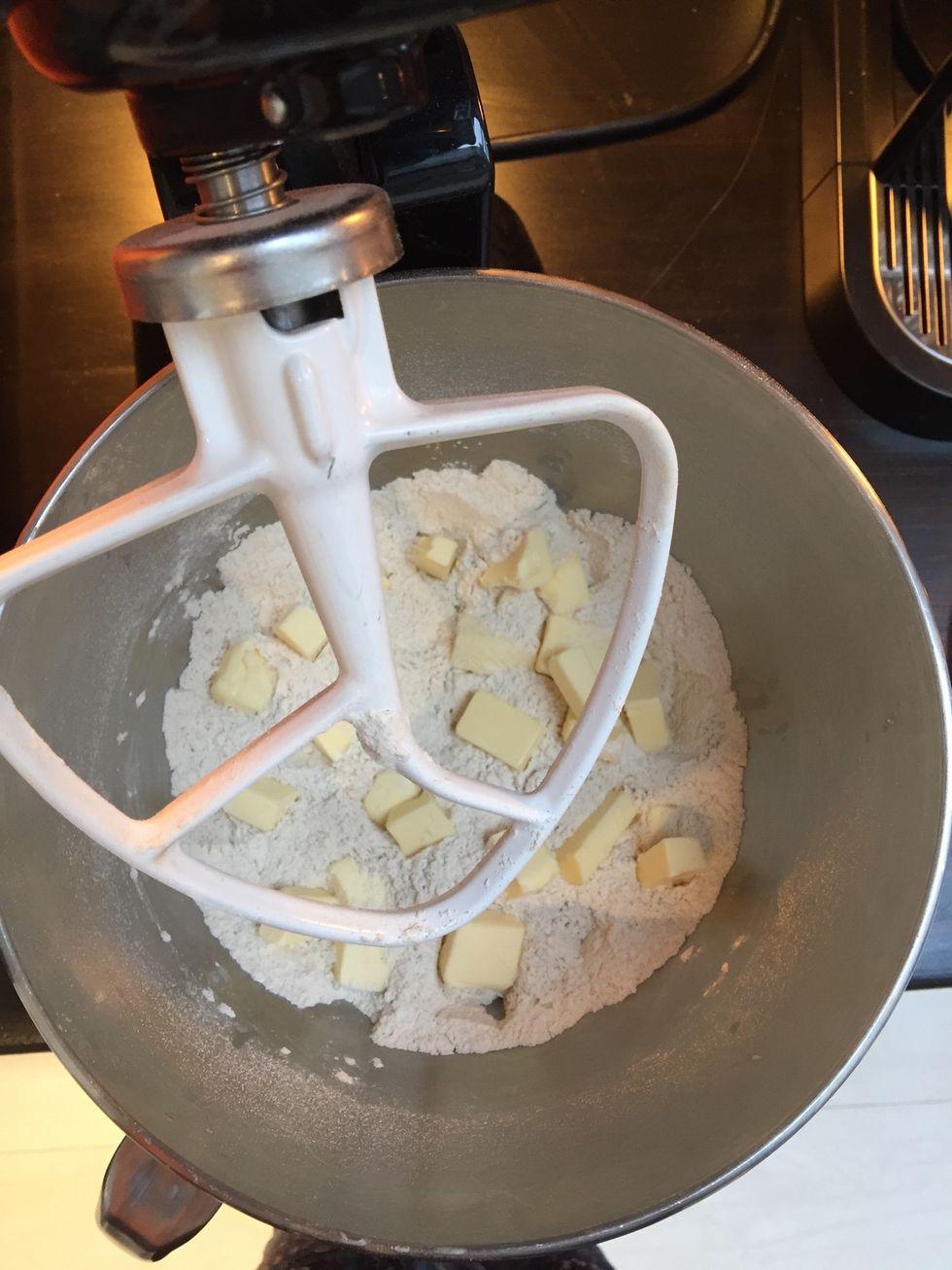 Once the flour is thoroughly combined, mix in the butter until the mixture resembles the texture of breadcrumbs.