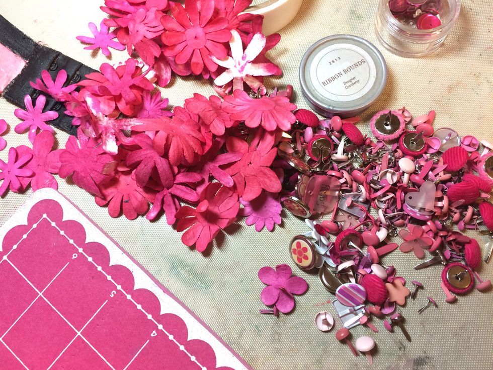 Once the flowers were dry, I stacked the smaller flowers onto the larger flowers and connected them all with a pink brad.