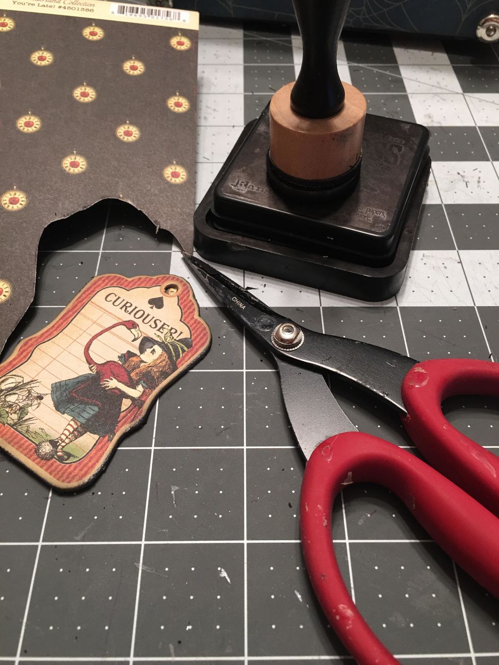 Once the glue has dried, cut the tag out with scissors and ink the edges. Now the back of the tag will be finished rather than having a cardboard back.