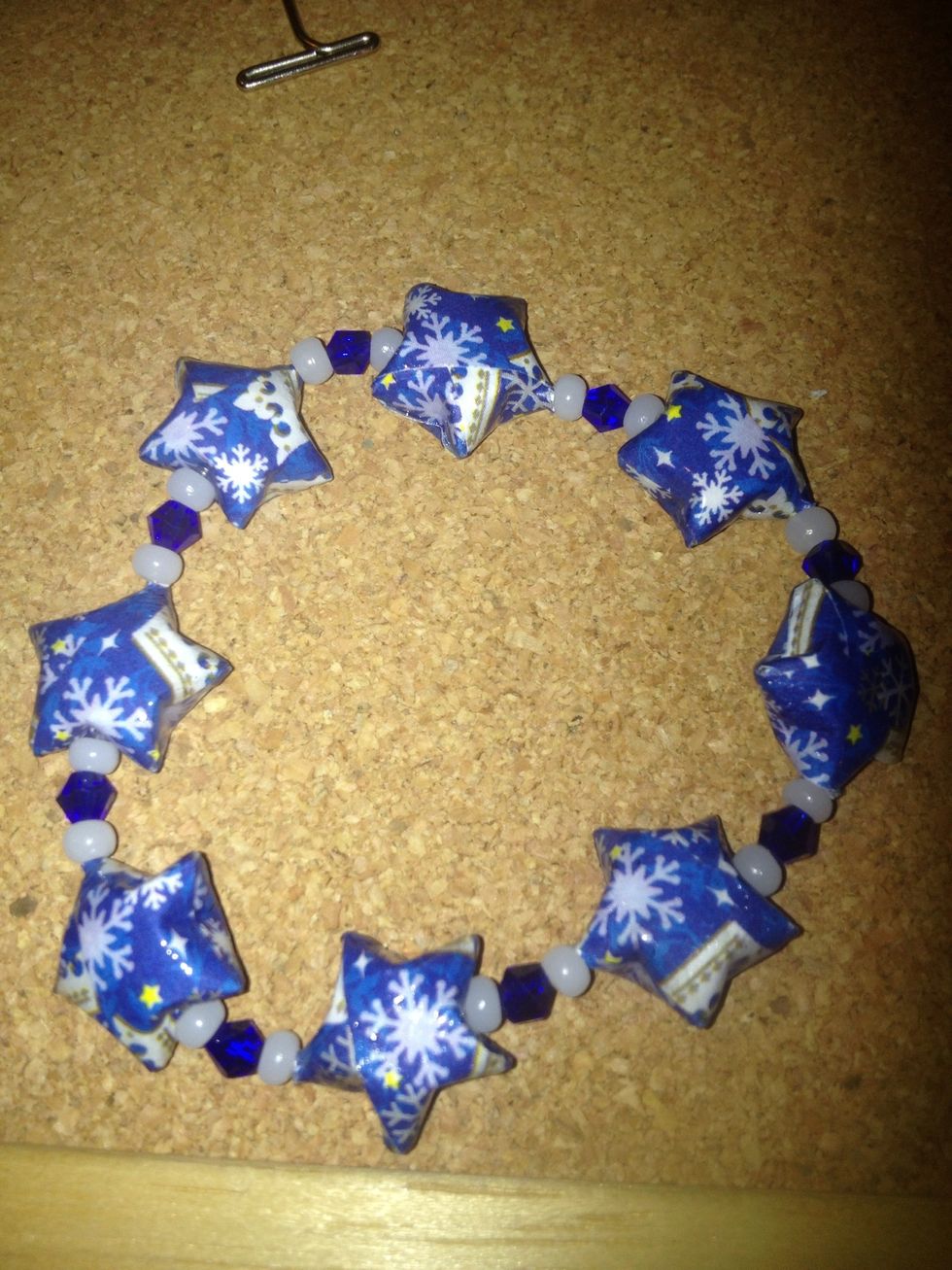 Once the glue is dry pull the cord on the opposite side of the star and make the knot go into the star. You don't have to pull that hard, a little tug or two should work.