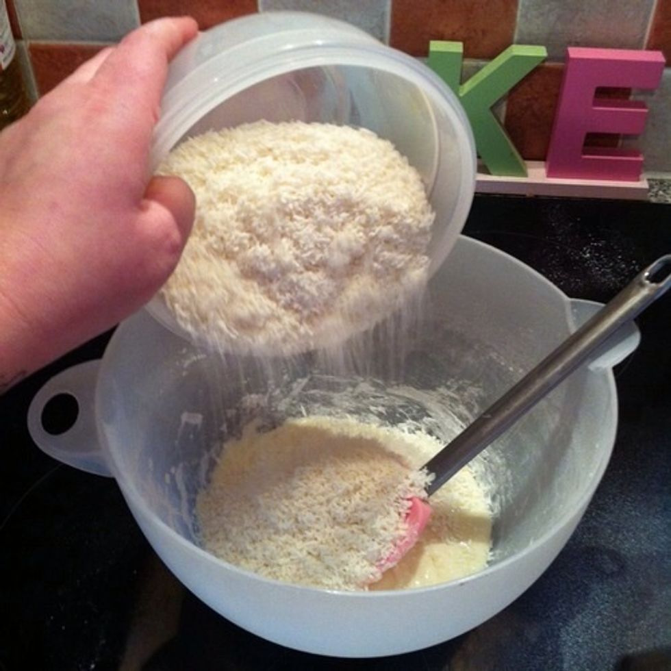 Once the icing sugar has been mixed in, pour in the desiccated coconut and mix. This will start to be very stiff so you will need to flex those biceps!!