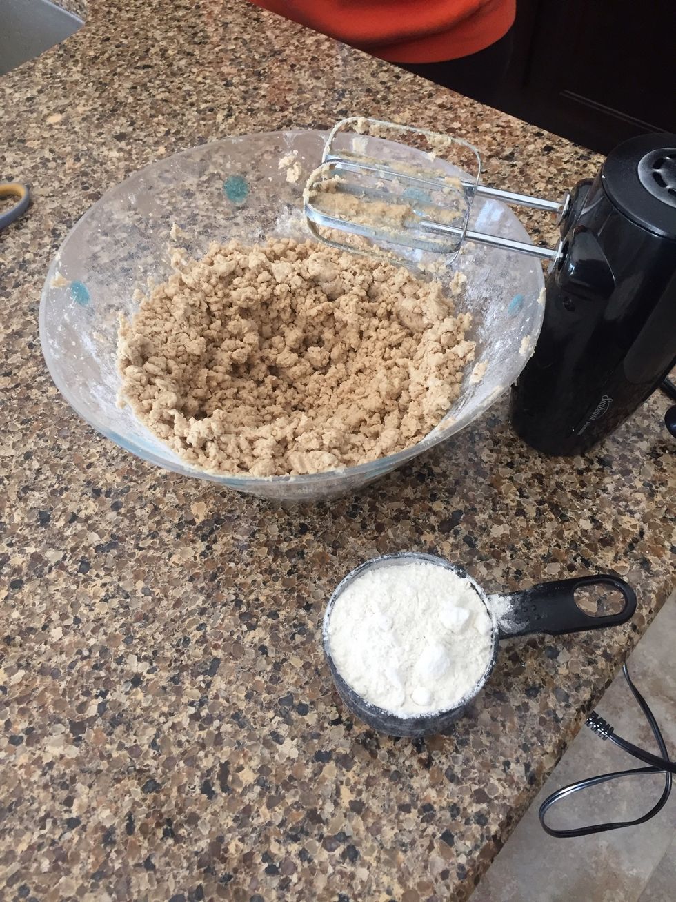 Once the ingredients are mixed, beat in the flour 1 cup at a time until you no longer see chunks of brown sugar.