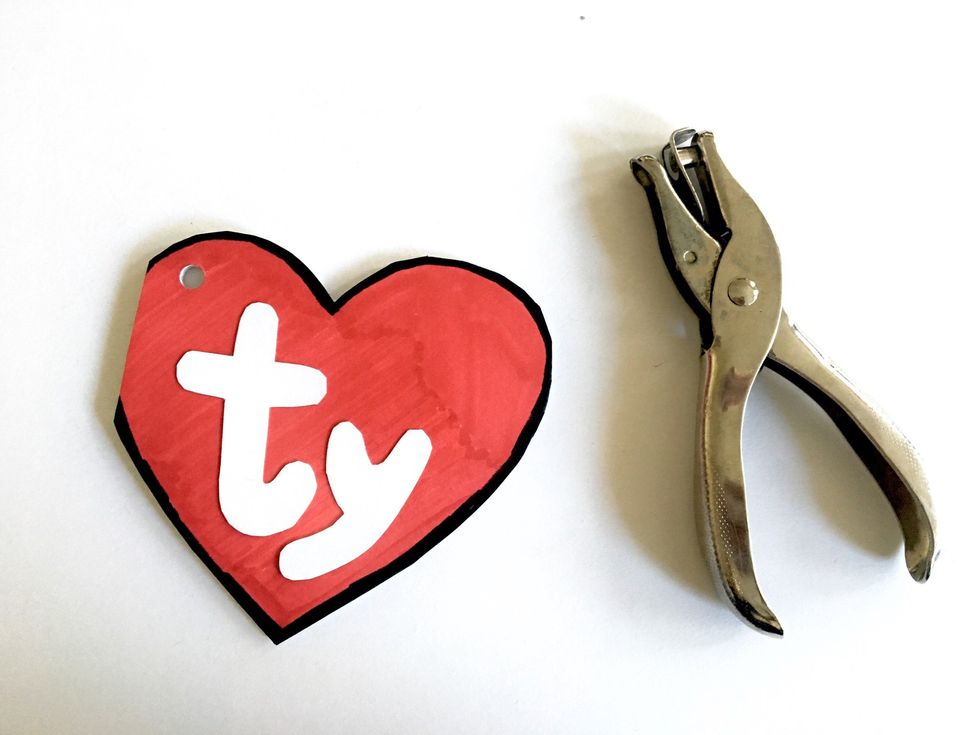 Once the inside is finished, punch a hole into the top left corner of the tag.