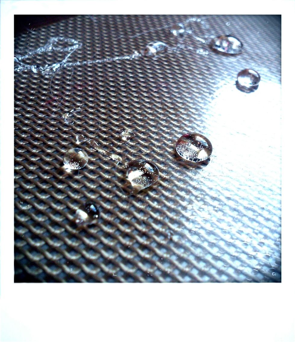 Once the isomalt turns to liquid remove from the heat (you should have already put together a piping bag made out of the parchment paper) pour the liquid into the piping bag & pipe out on silicone mat