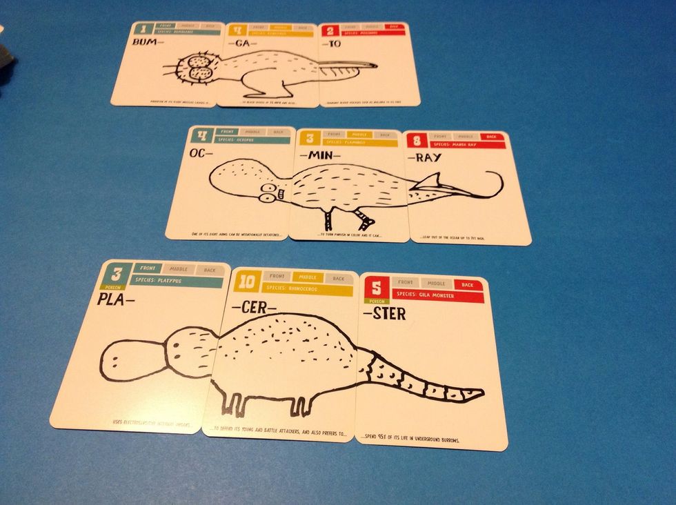 Once the learner has independently made three creatures with a front, middle, and back, have him/her pronounce the name of each new creature and read about its features at the bottoms of the cards.