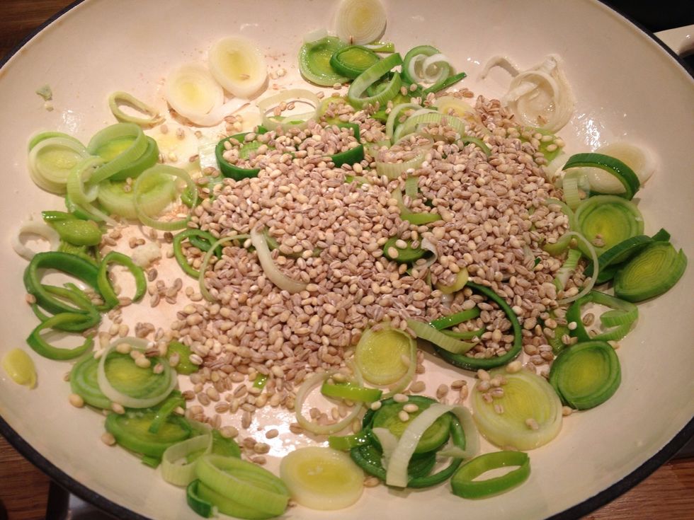 Once the leeks start to soften add two handfuls of barley