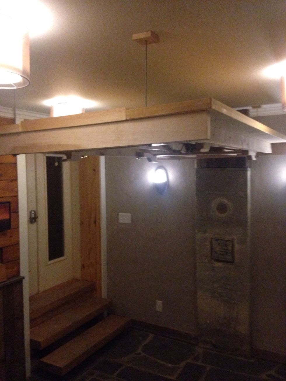 Once the legs are locked in, continue raising the table