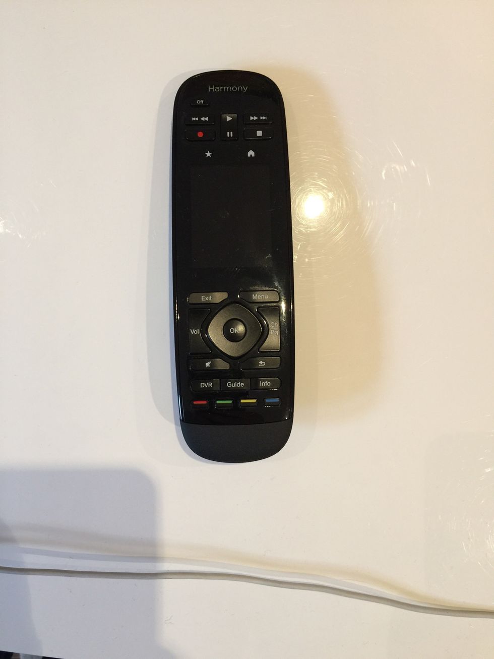 Once the light on the Harmony Base Station is green again, press the "OFF" button on the Harmony Remote to start it up. It may take a few seconds to get it to start.