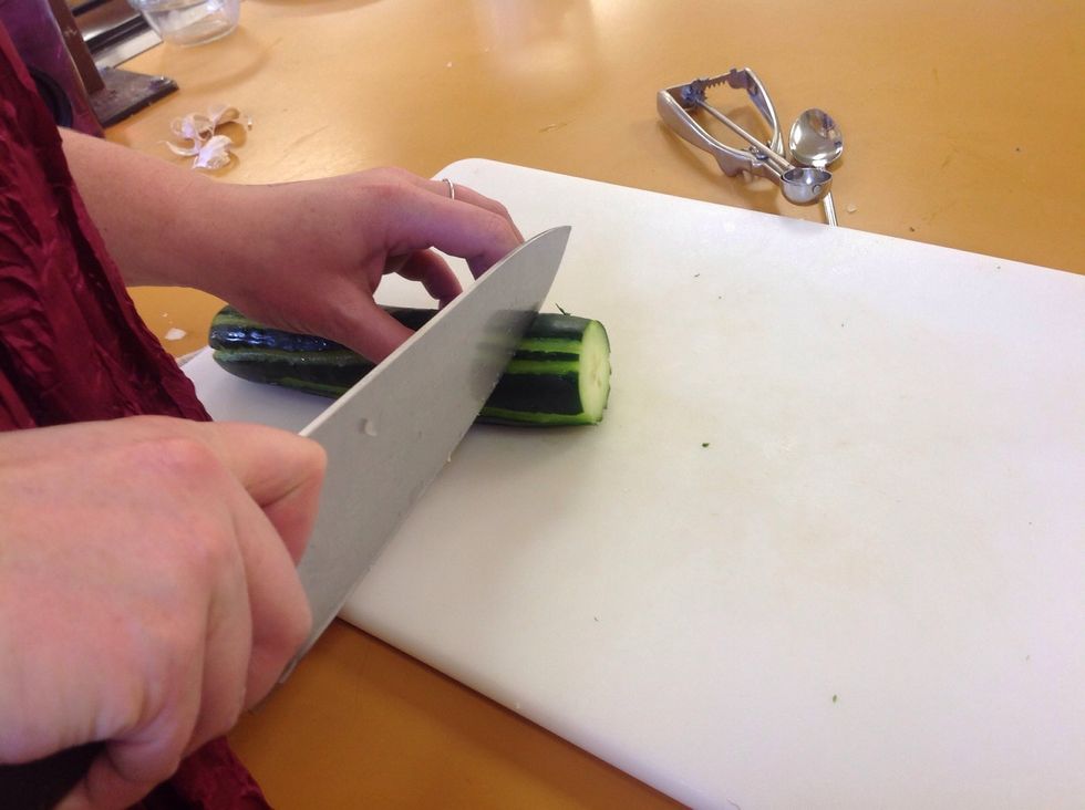 Once the lines are made cut off both ends of the cucumber. Slice the cucumber making slices about an inch thick. You want the slices to be thick, this will make them easier to pick up when eating.