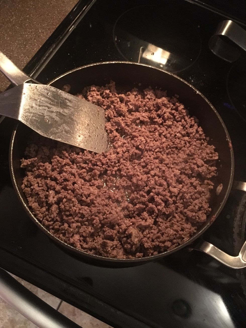Once the meat is brown, drain the grease.