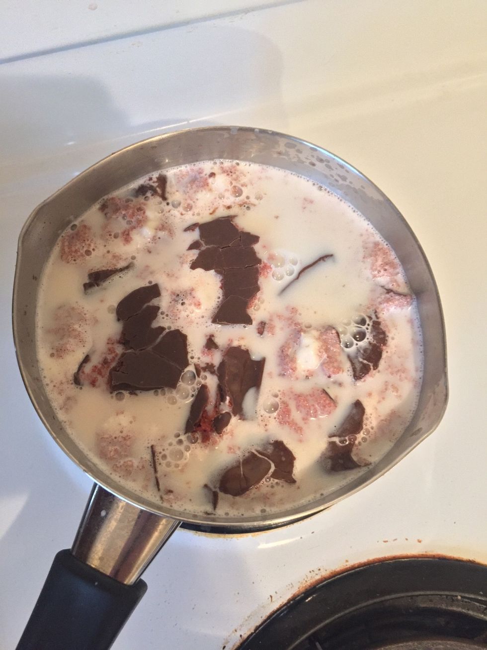 Once the milk is hot and starts steaming, break up Jos Louis and add to the milk