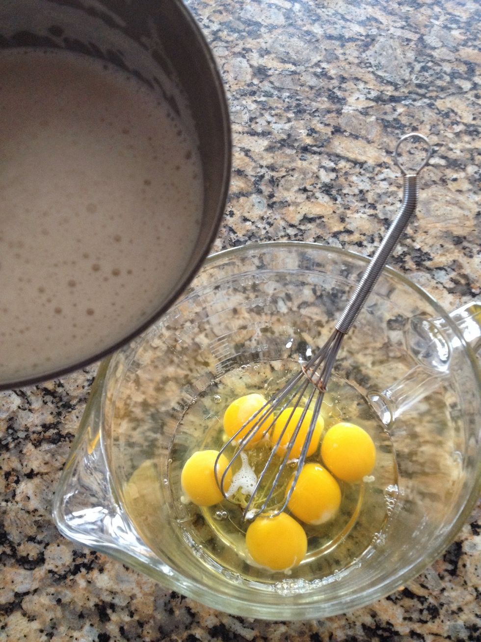 Once the milk mixture has cooled, whisk into the eggs and blend well