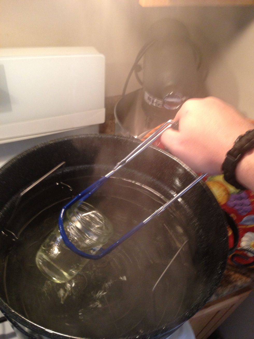 Once the minute is up, remove from heat. Using jar tongs carefully remove the mason jars from the boiling water. Turn the heat down to avoid splashes but you will need to boil it again.