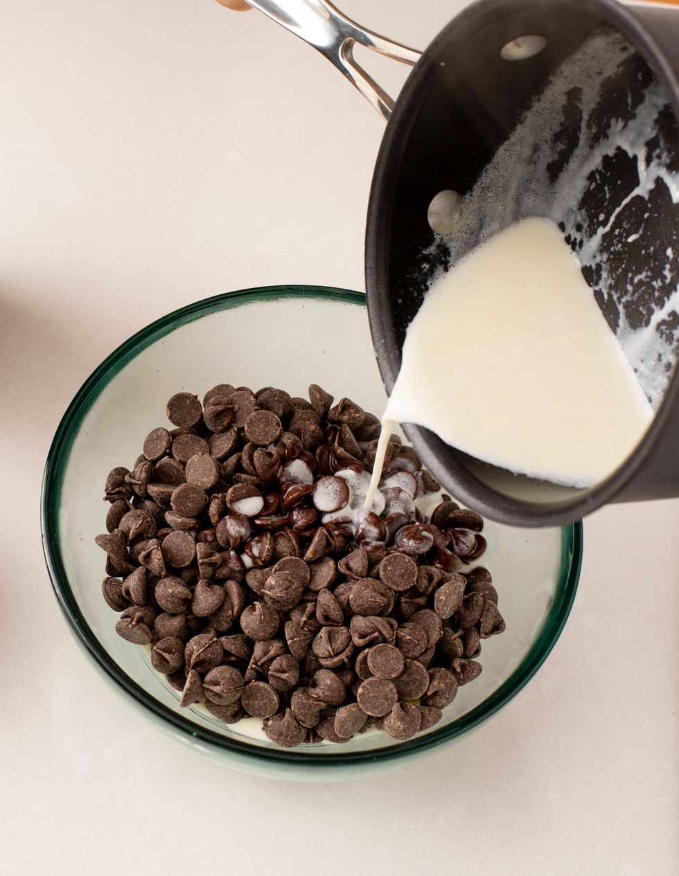 Once the mixture begins to boil, pour over the chocolate chips and let it sit for two minutes. Mix the chocolate and the cream until all the chocolate is melted.