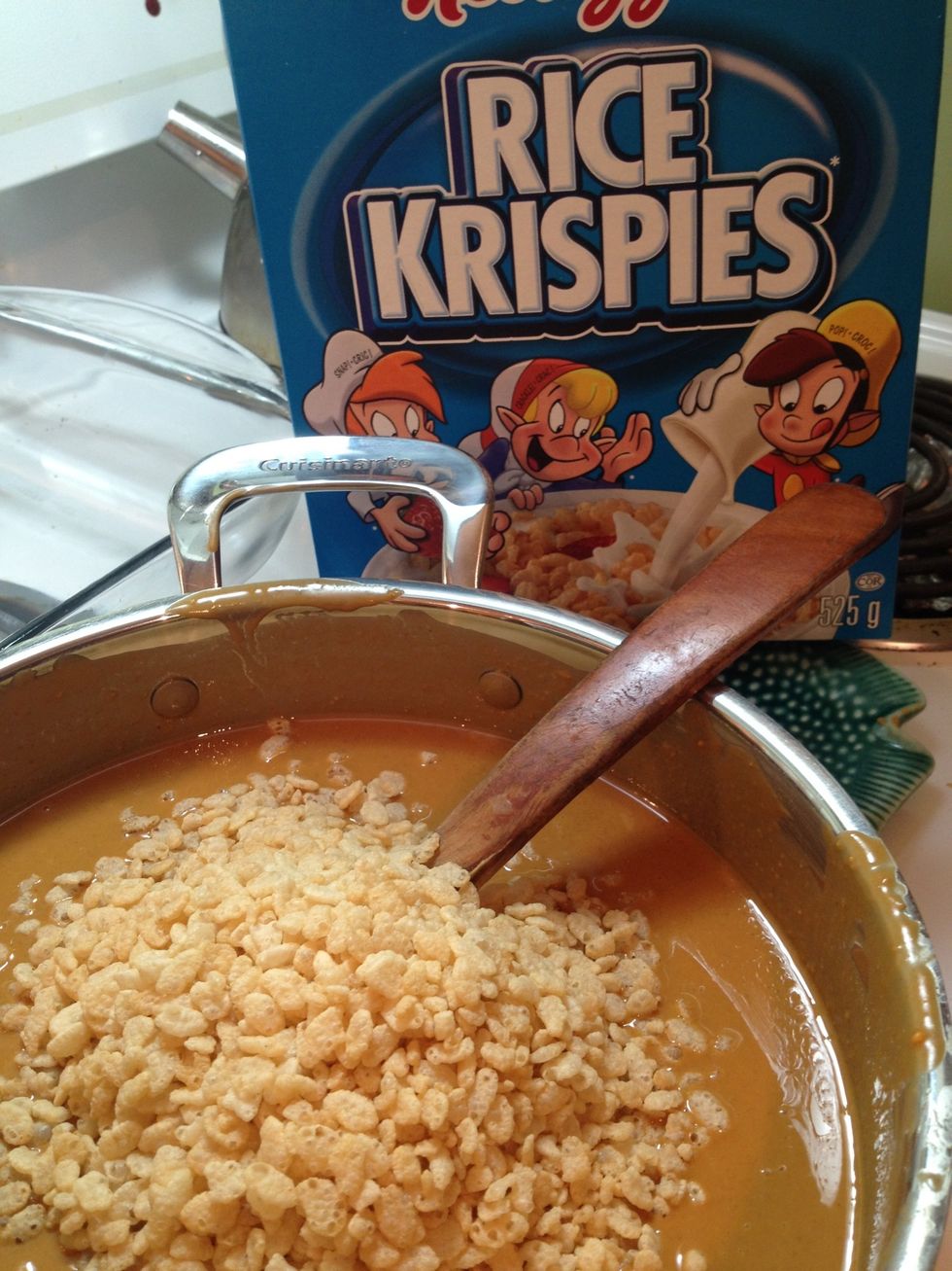 Once the mixture has cooled to luke warm, add Rice Krispies.