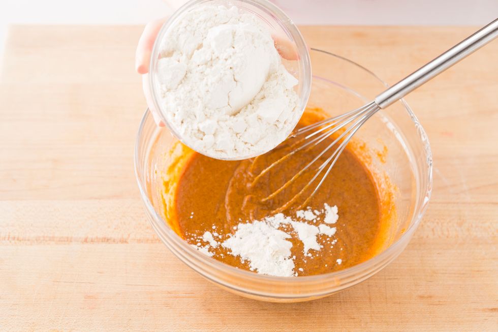 Once the mixture reaches a consistent texture, add one cup of flour.