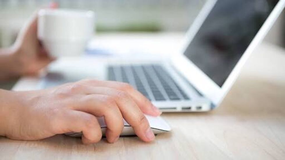 Once the mouse is plugged in place your hand on it and move it around the desk