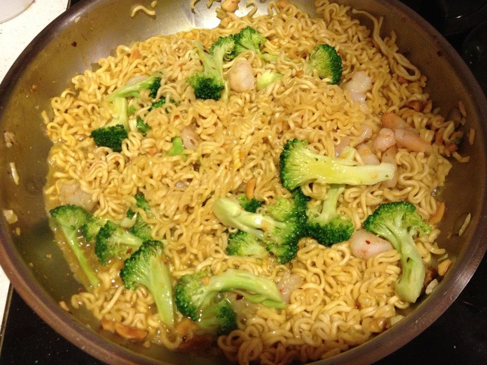 Once the noodles begin to soften and become more noodle-like, add powdered seasonings (curry or turmeric, 1 pkg of ramen seasoning) and veggies/shrimp. Finish cooking, should only take 2-4 minutes.