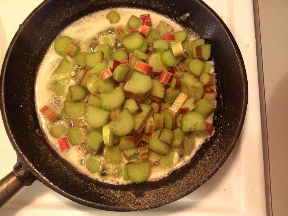 Once the oats are roasted remove from the pan. Add the butter and the rhubarbs to the skillet.