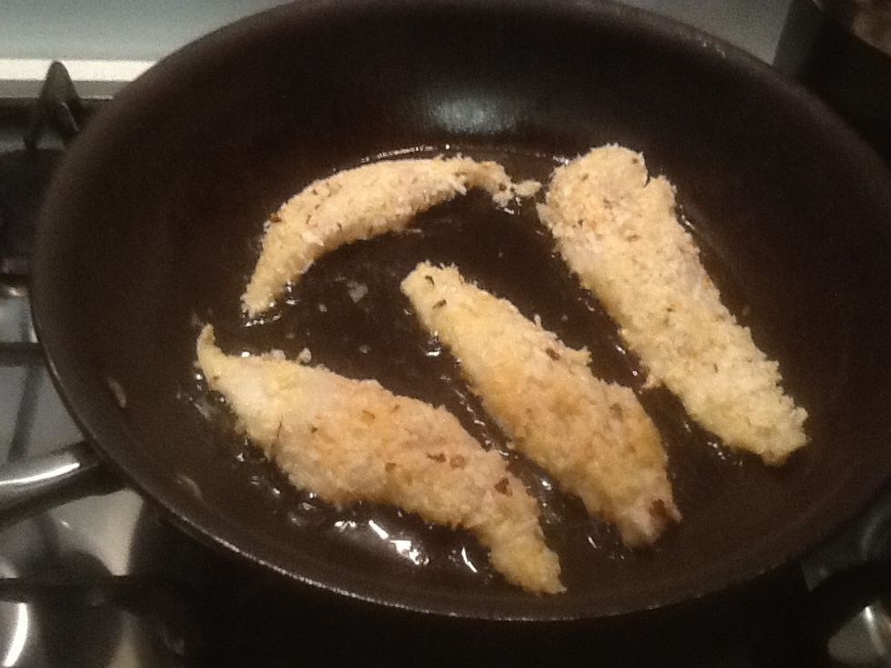 Once the oil has started to boil place the fillets on to the pan