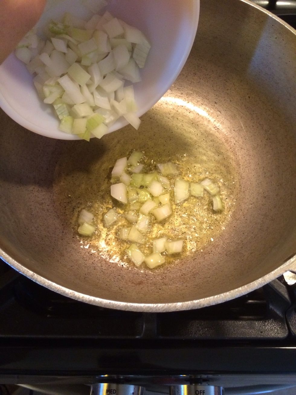 Once the oil is hot add the onions