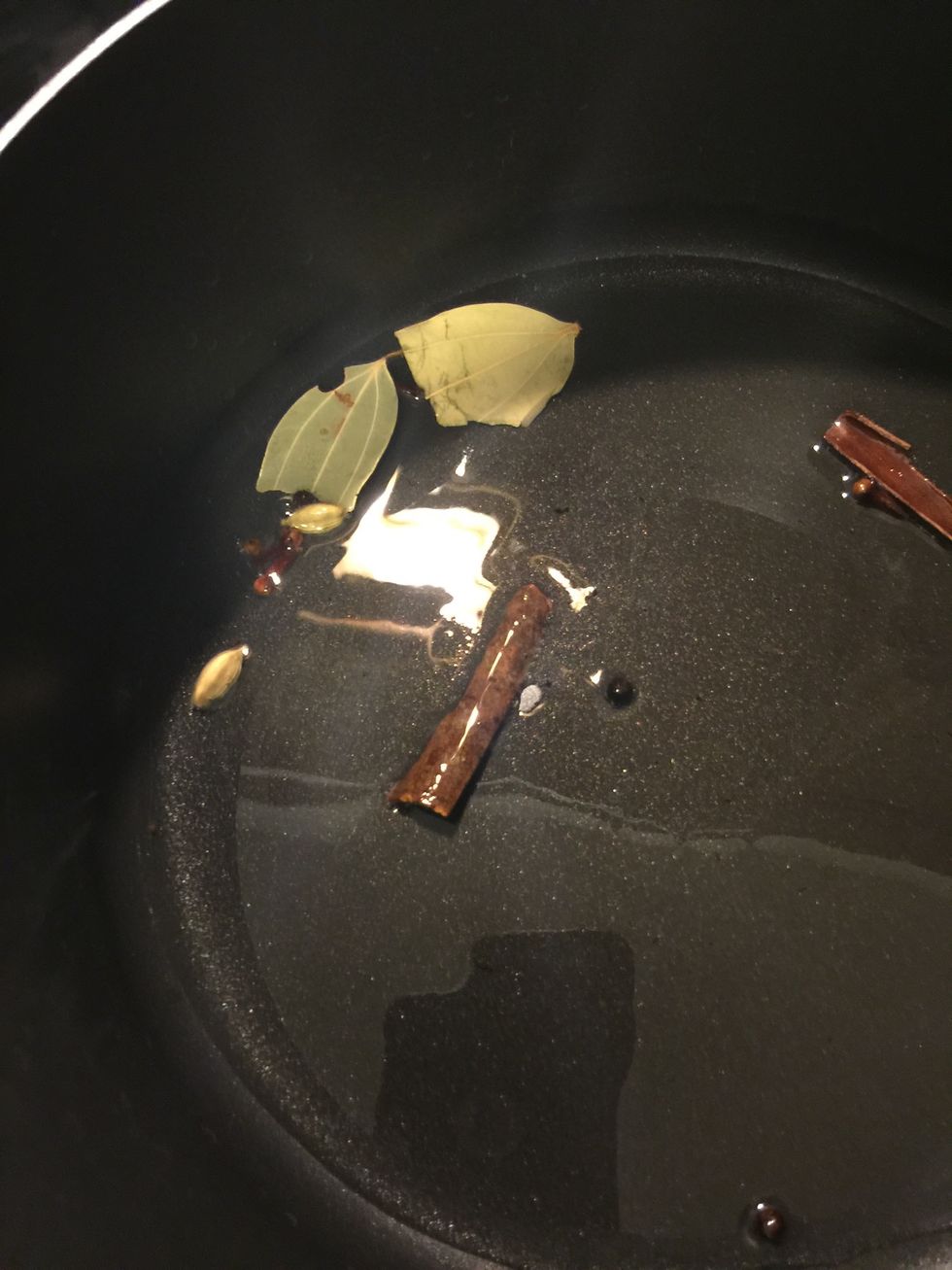 Once the Oil is hot,add the whole garam masala to the oil, and let it sizzle, till they release their aroma.