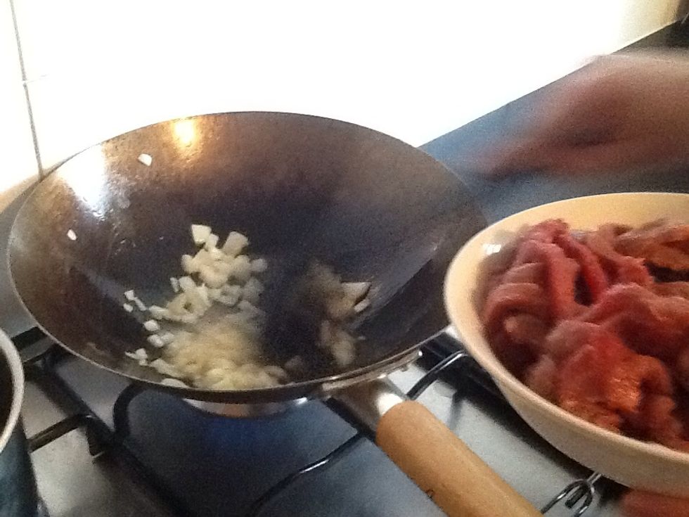 Once the onion and ginger is transparent and the flavour has already been transferred, place 400 grams of Lean beef into pan.