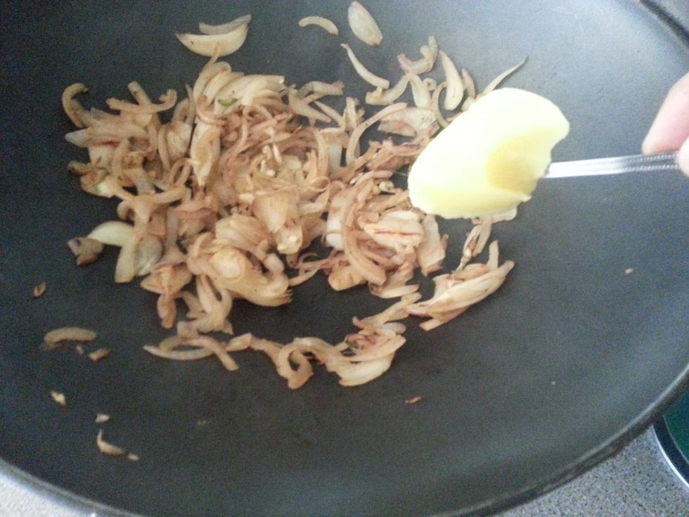 Once the onion has colored slightly add ghee. Cook for a minute before adding panch poran. Cook for a further 10 minutes till onion is golden brown.