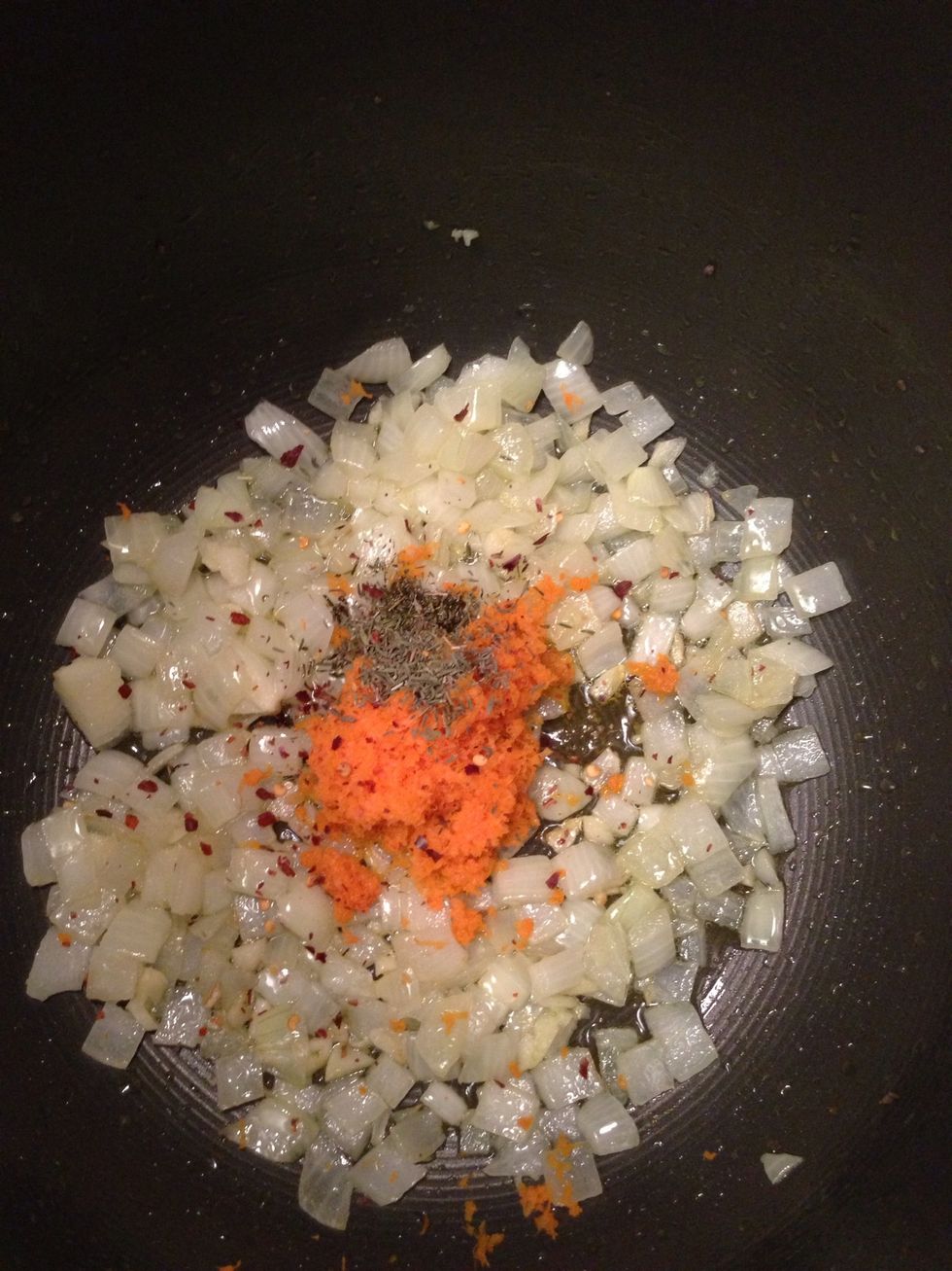 Once the onions are soft, throw in the carrot, thyme and some red chili flakes if you want it to have a little bite.