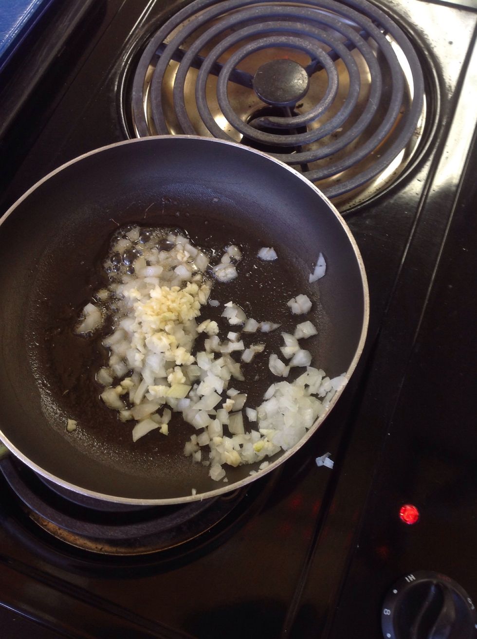 Once the onions are translucent add in the minced garlic, continue to stir constantly. If the onions and garlic begin to burn, pull the pan off the burner and adjust the heat. You are in charge!