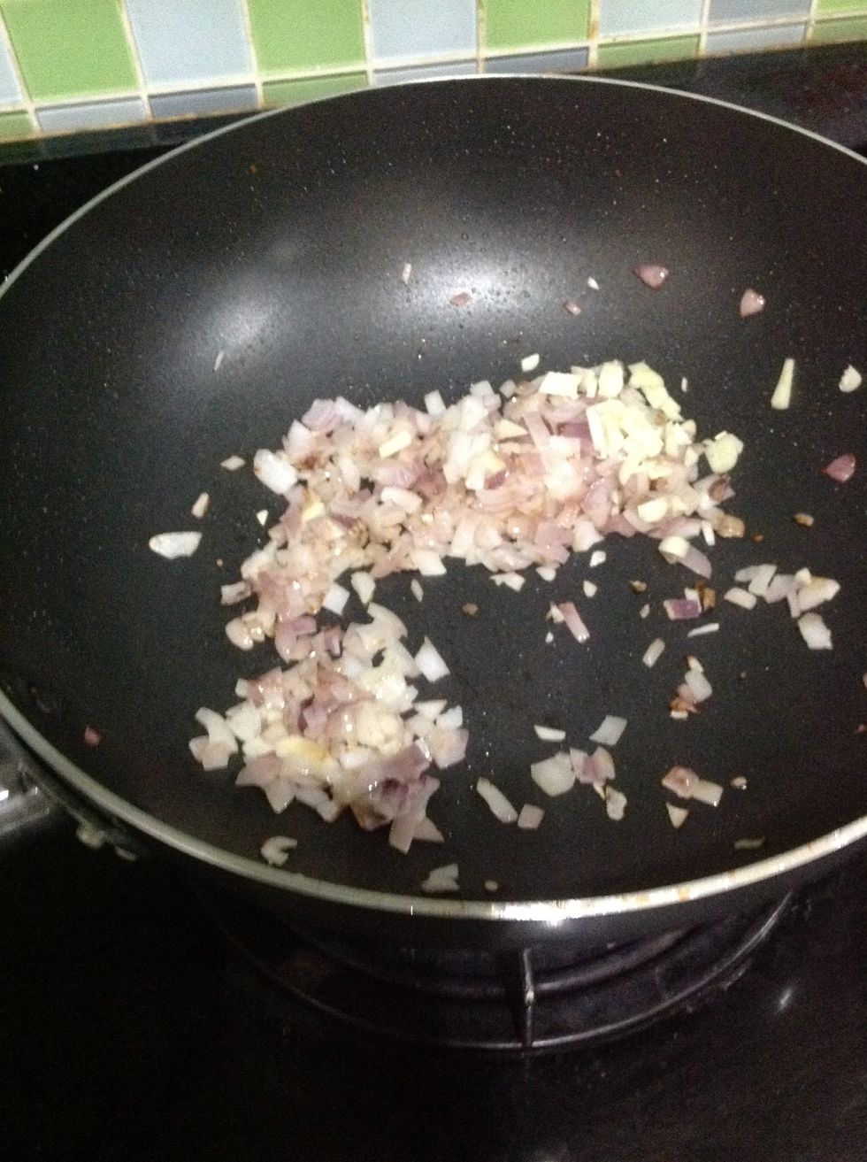 Once the onions have cooked down a bit, add the minced garlic.