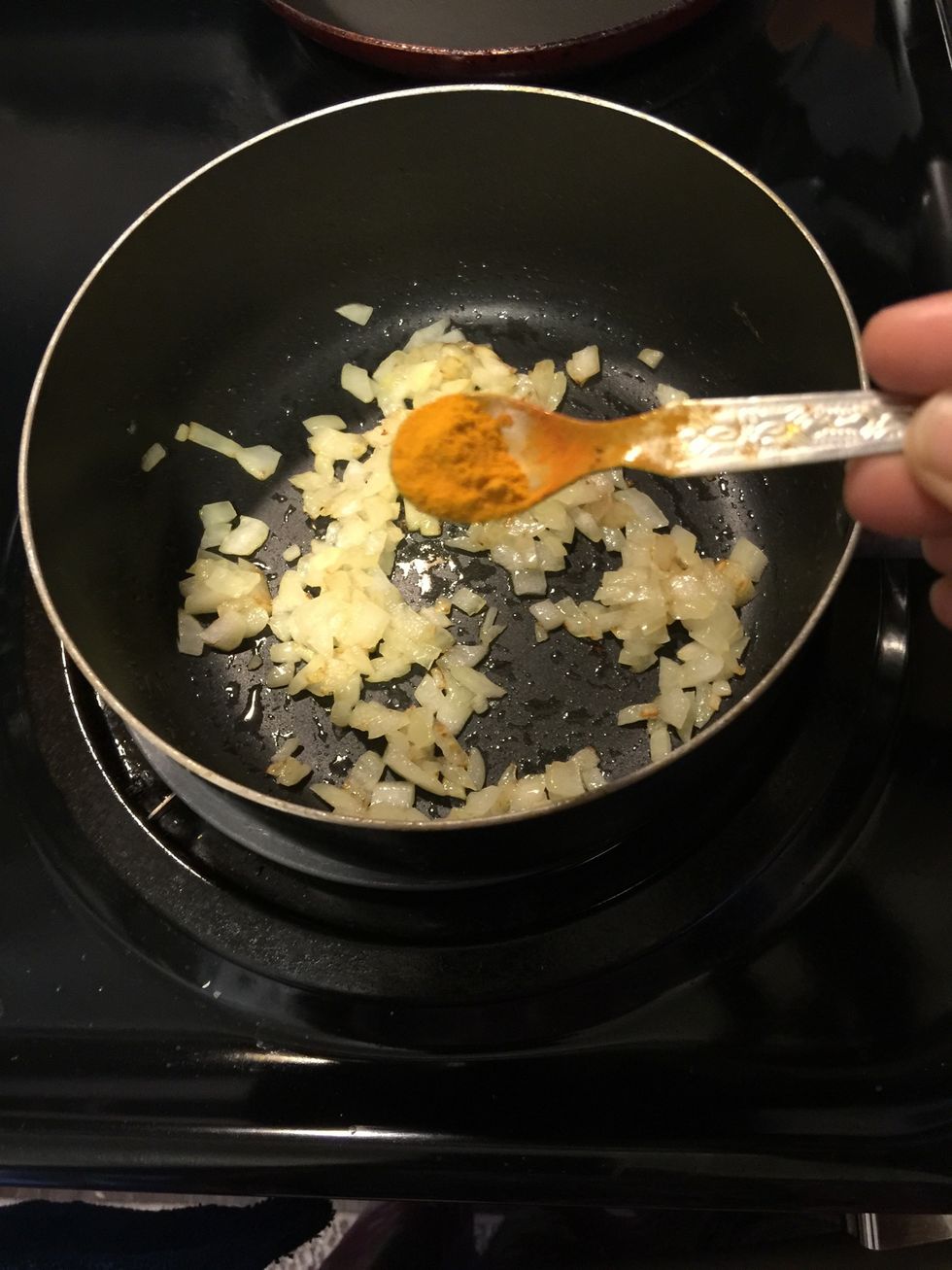 Once the onions start to brown add 1/2 tsp of turmeric powder.