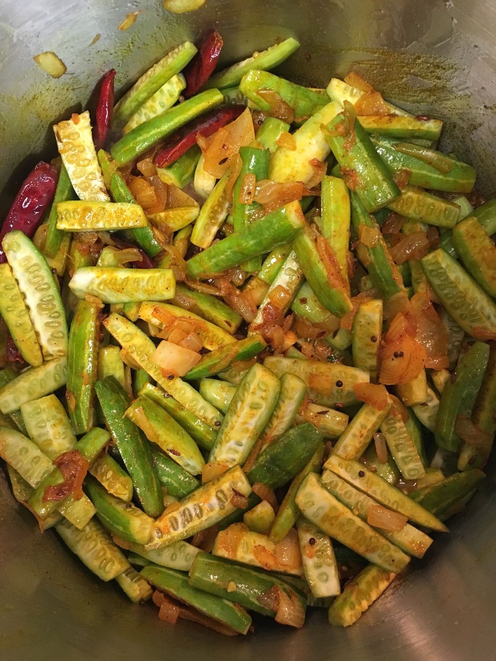 Once the onions turn translucent, add ground turmeric, paprika and ivy gourd. Stir well. Now add Goda Masala (optional, see next slide).