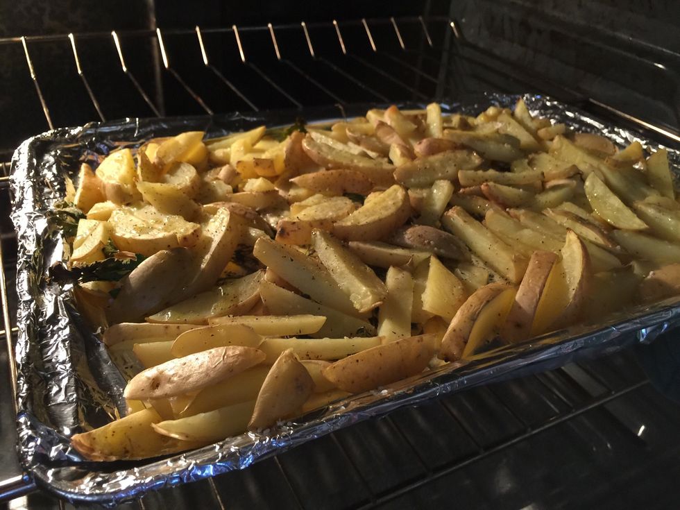 Once the oven is hot, add the fries to the oven to roast.
