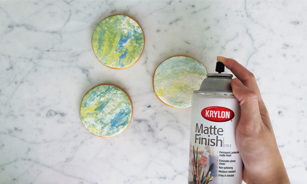 Once the paint is completely dry, spray a water based sealant to lock in the colours and to make the coaster water proof.