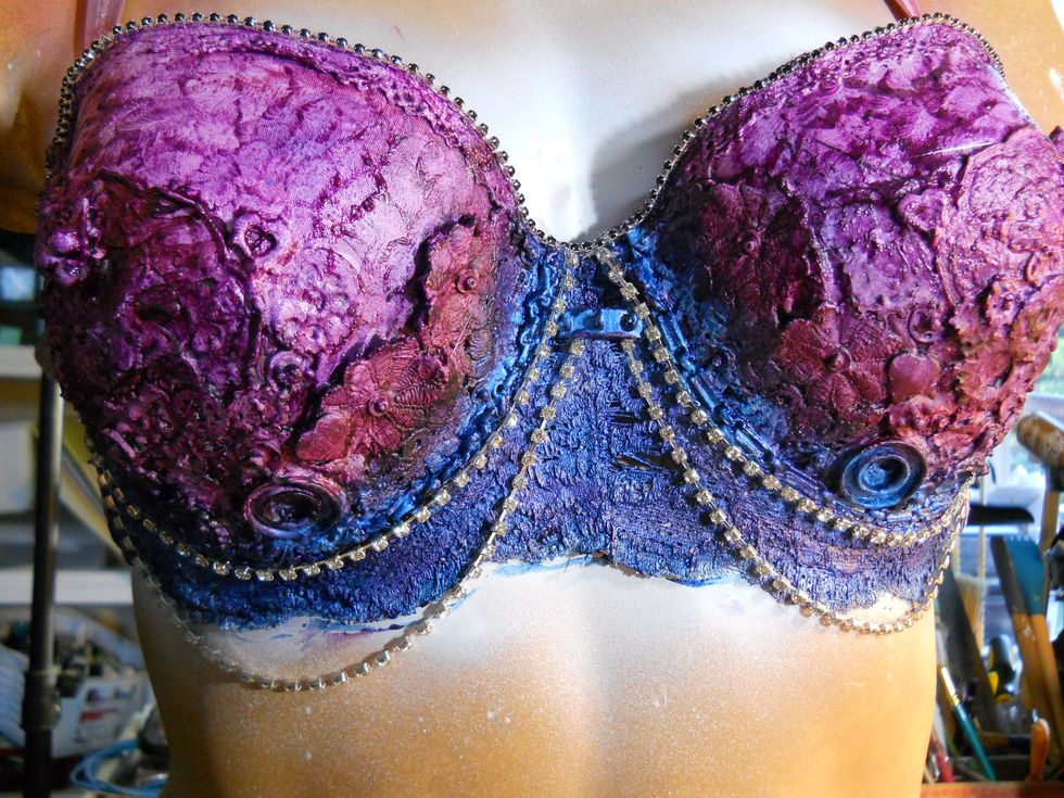 Once the paint is completely dry, Use a hot glue gun to adhere rhinestones and chains.