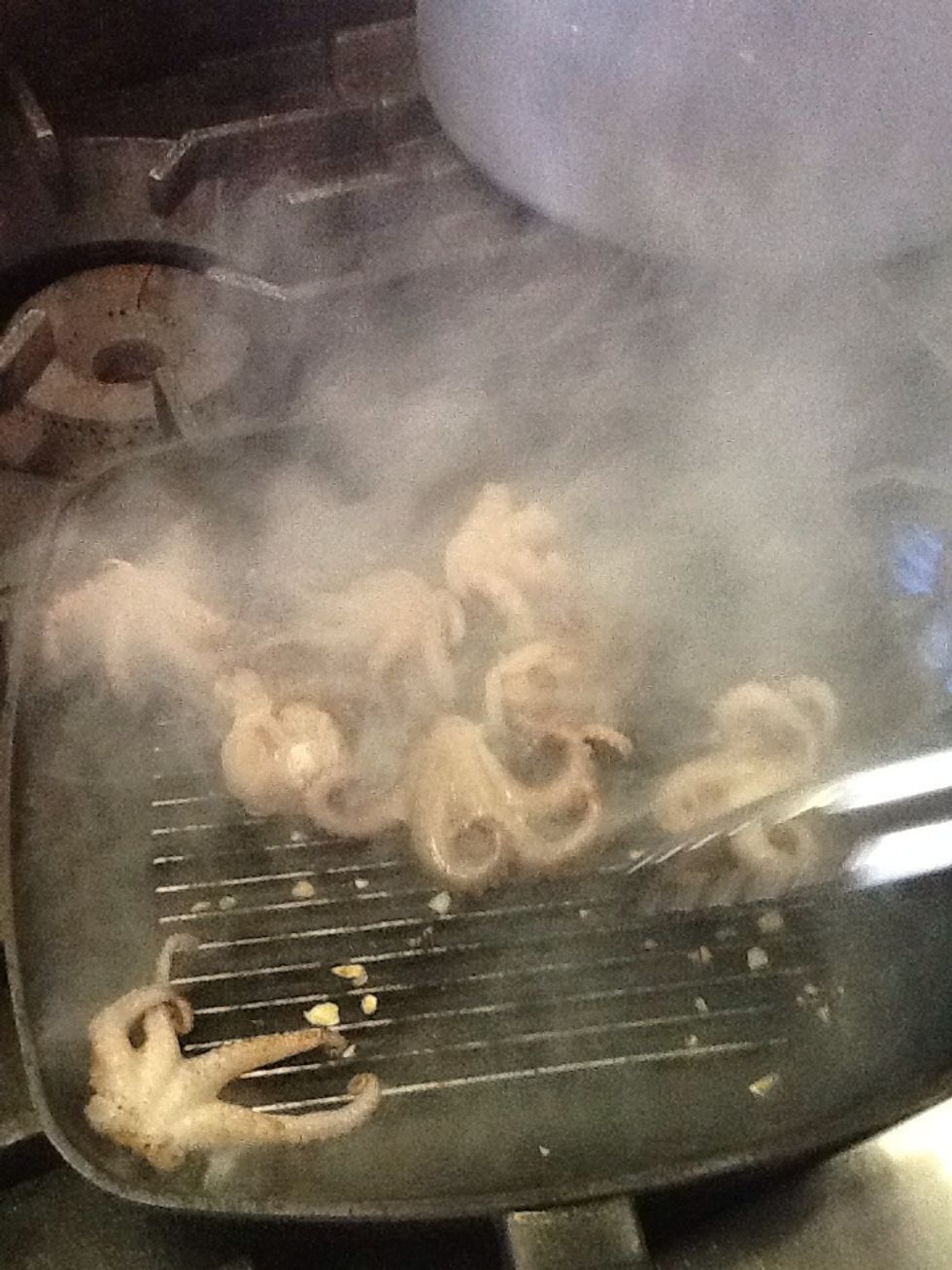 Once the pan is heat grill the octopus until tender