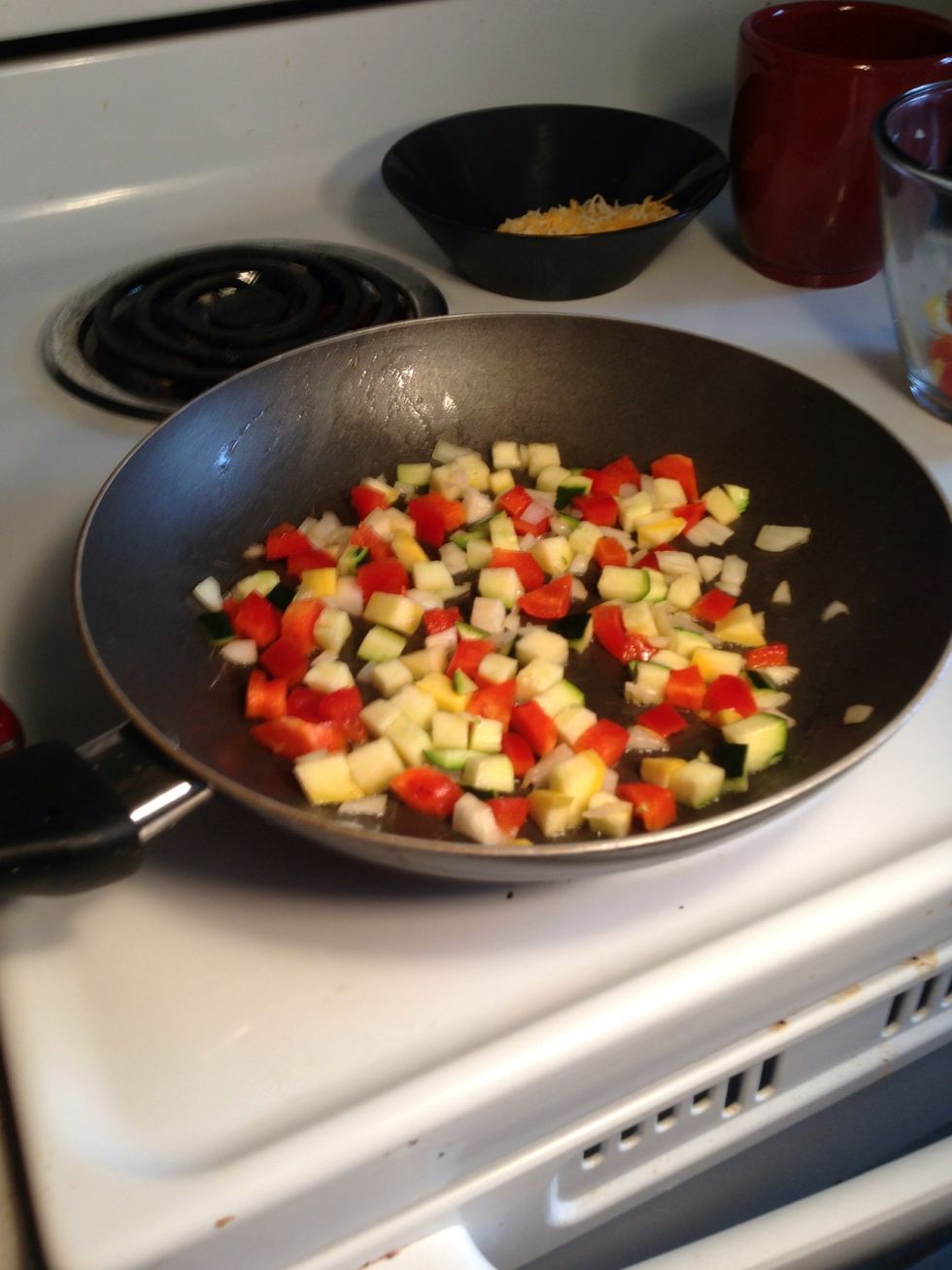 Once the pan is hot, evenly distribute the chopped vegetables and cook till they begin to brown