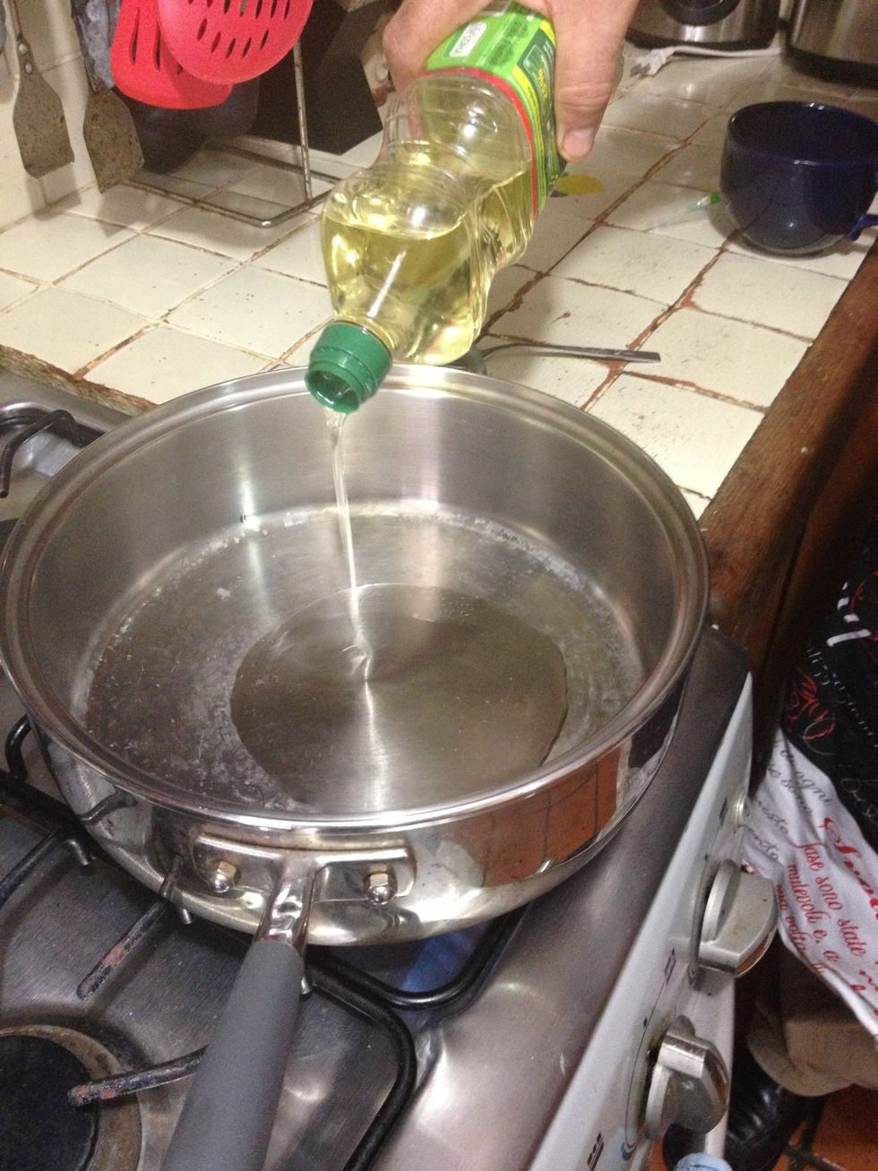 Once the pan is hot, pour some oil into it. Enough to cover the whole pan.