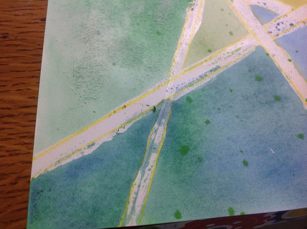 Once the paper is fully dry, rub the rubber cement off. It will make little gunky balls. Try to pick them up as you go. It's easier to do this now than to try to get off later!