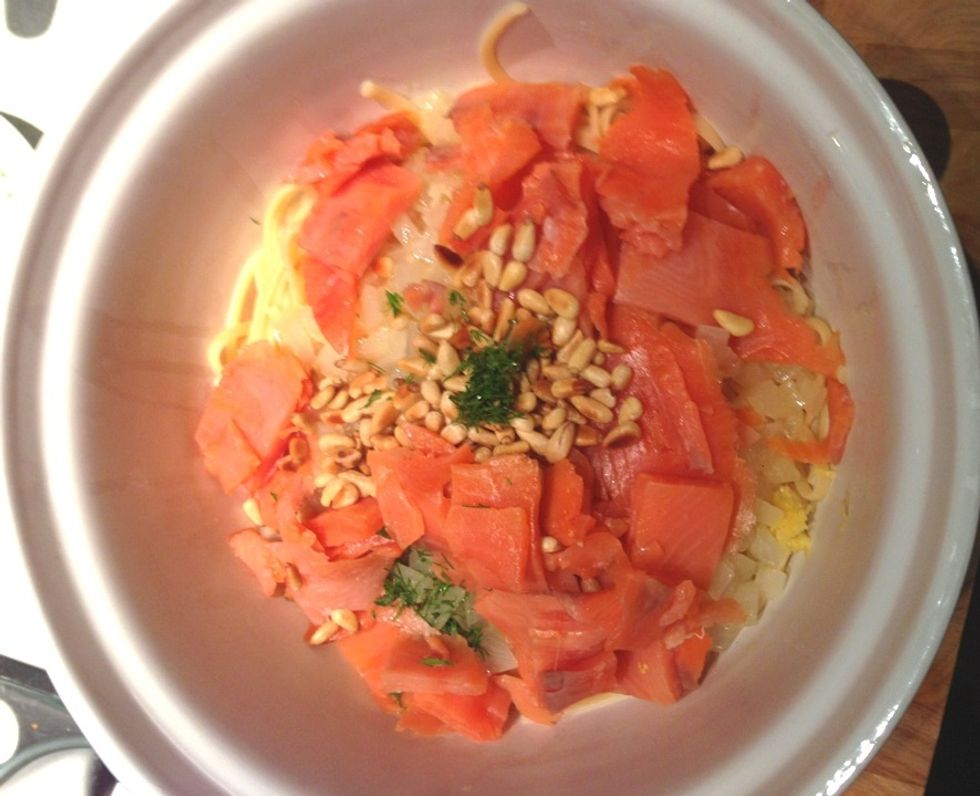 Once the pasta is ready, place them into a bowl. Transfer the white wine sauce into the bowl. Add the smoked salmon, toasted pine nuts, parsley, and the remaining lemon zest. Toss the pasta.