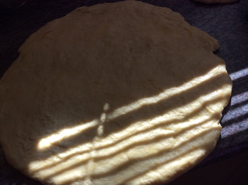 Once the pastry has been in the fridge for 1 hour, make sure that you leave a quarter of the pastry a side to make the lid of your apple pie,then roll the pastry out 1inch more that your dish plate.