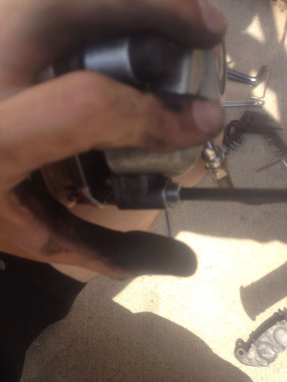 Once the pin is inserted into the two pads, use the Allen wrench to screw the pin back into the caliper.