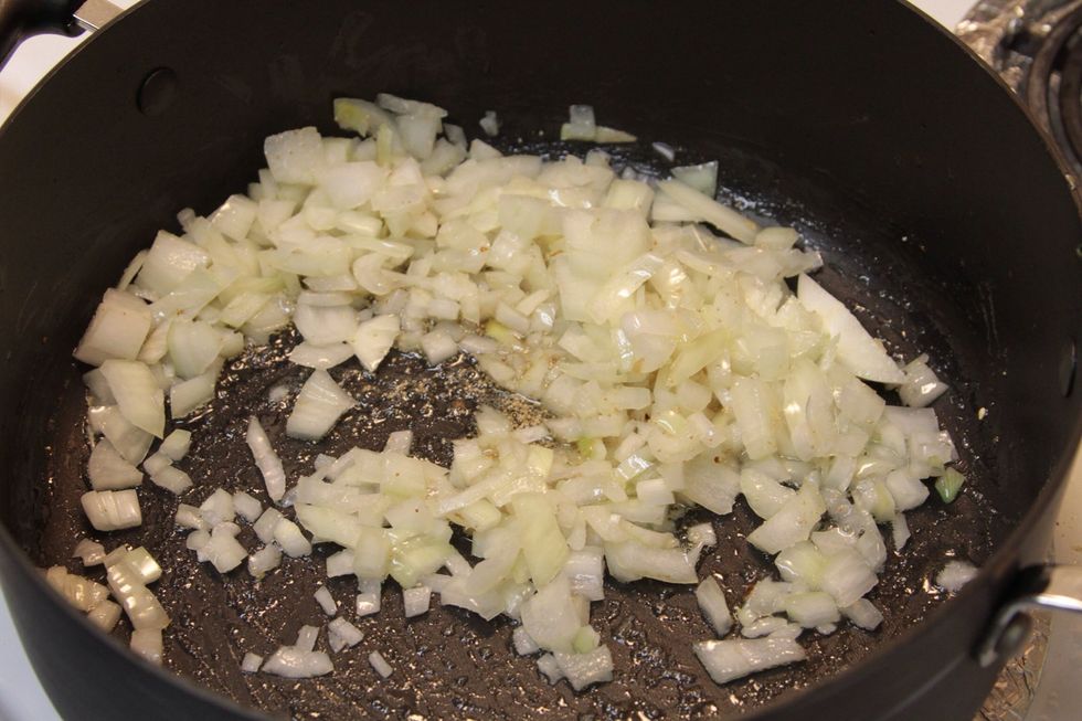 Once the poppy seeds become brown add the chopped large onions