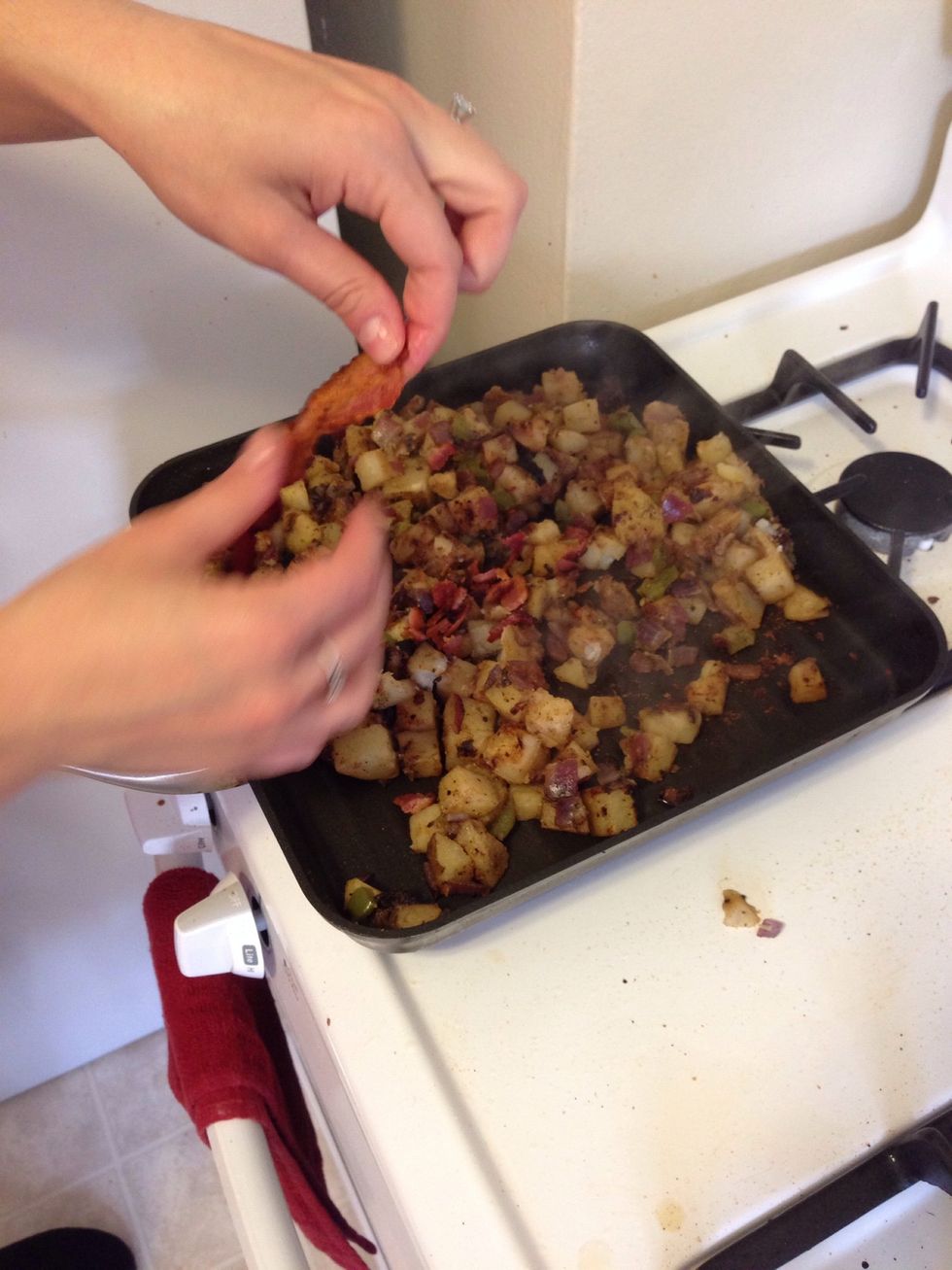 Once the potatoes are finished cooking, year up the bacon and add to the mixture.