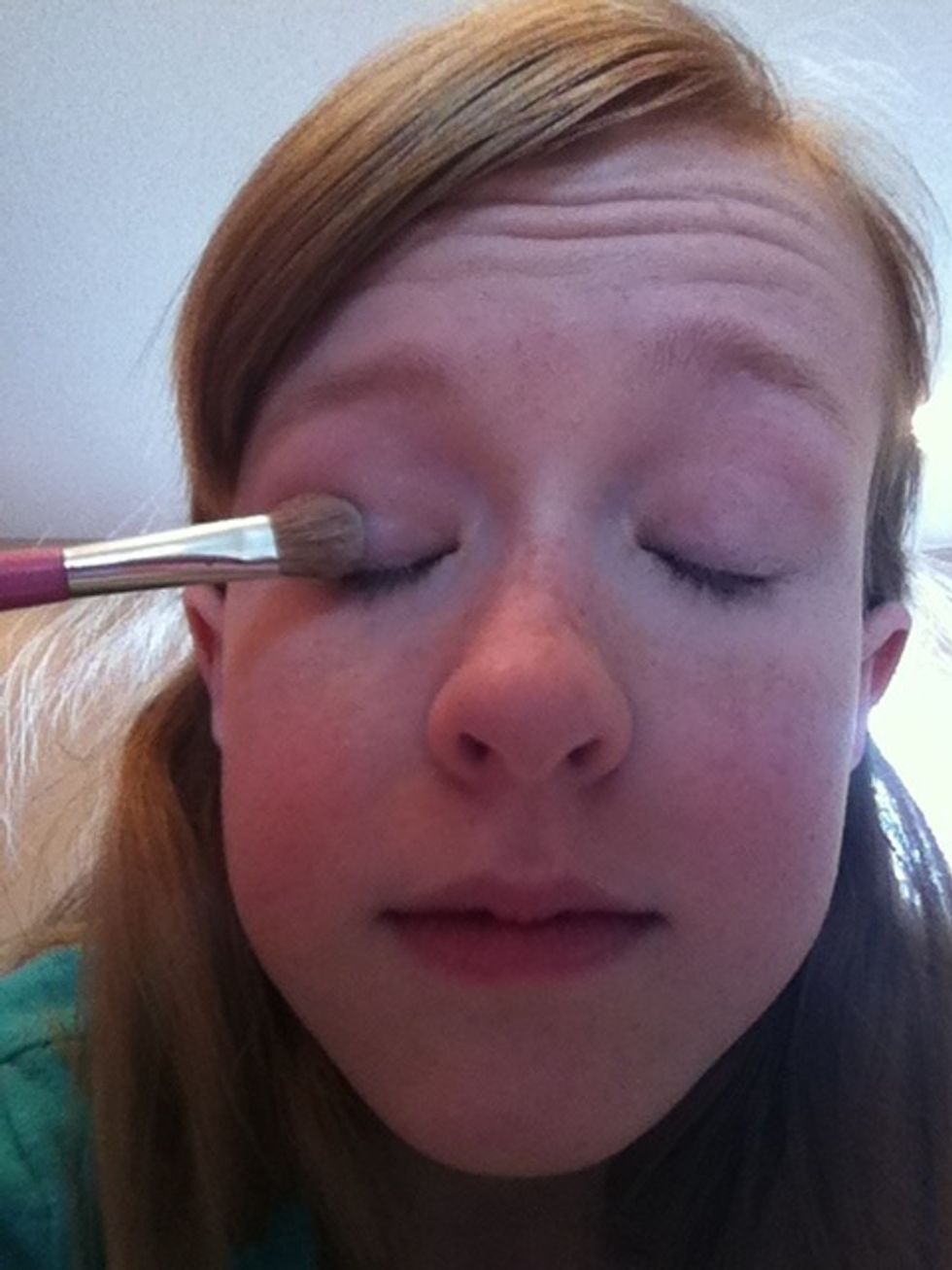 Once the primer is blended, you can begin with our shadow. I am doing "smokey eye," so I cover my whole lid with shimmery white.