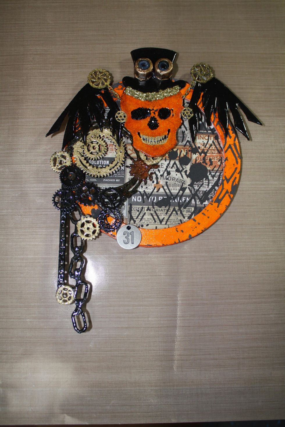 Once the project is assembled, apply Glossy Accents to the eyes and nose area and add the black glitter.