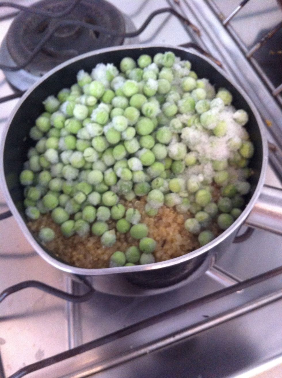 Once the quinoa's cooking time is done put peas on top and lid on for it's resting time of 10 mins. This will defrost the peas and cool down the quinoa at the same time!