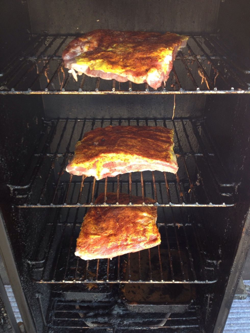 Once the ribs have set to room temp for about 45 min, place the ribs in the smoker, making sue not to allow the ribs to touch the sides.